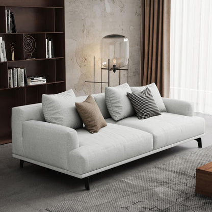 Canapé droit en tissu beige avec accoudoirs carrés