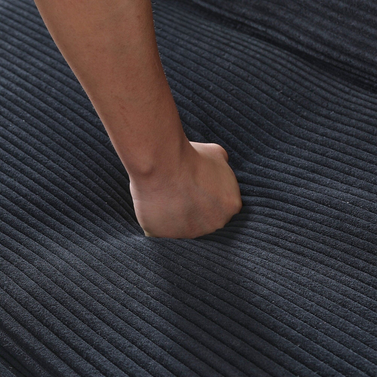 This 66-inch corduroy sofa bed can switch between the two comfortable forms