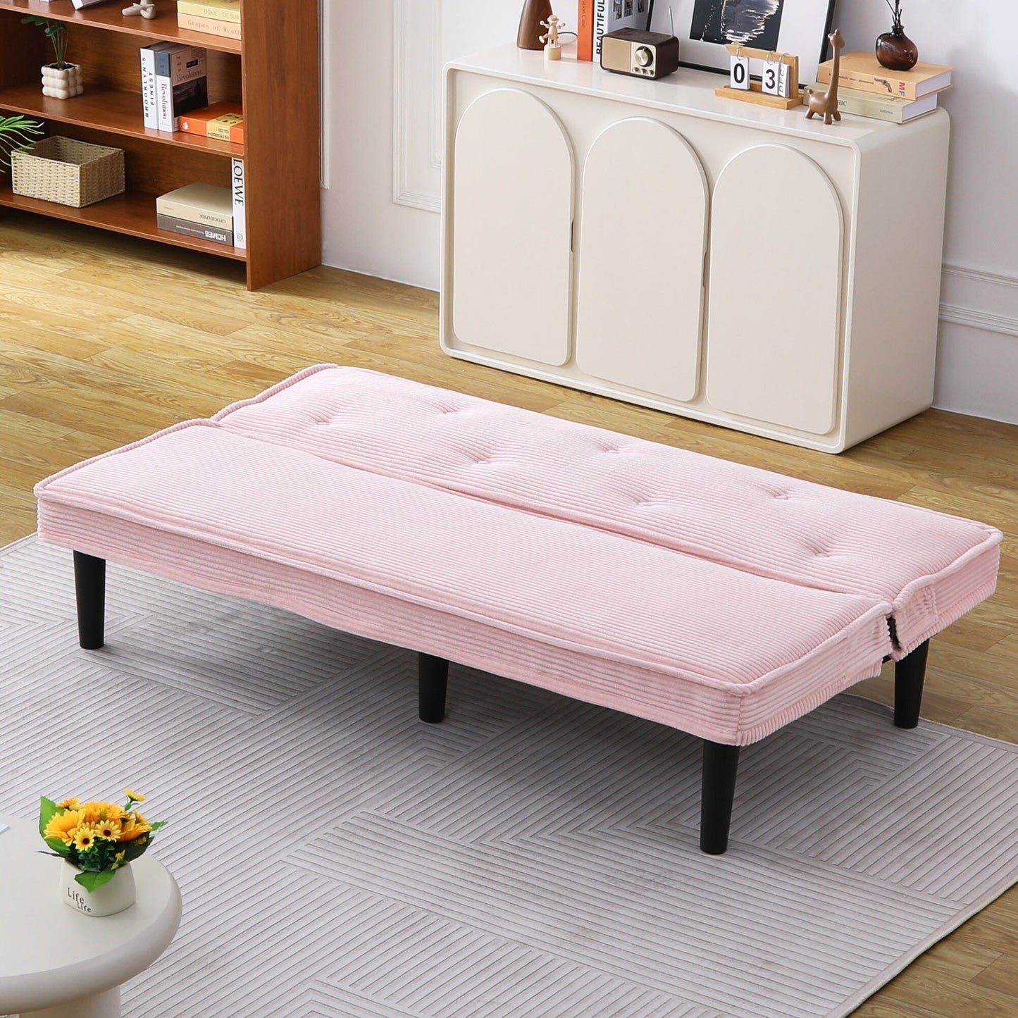This 66-inch corduroy sofa bed can switch between the two comfortable forms