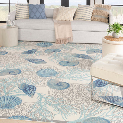 Tapis d'intérieur et d'extérieur Waverly Sun &amp; Shade Shore Thing à motif de coquillages tropicaux et floraux