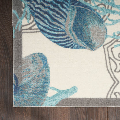 Tapis d'intérieur et d'extérieur Waverly Sun &amp; Shade Shore Thing à motif de coquillages tropicaux et floraux